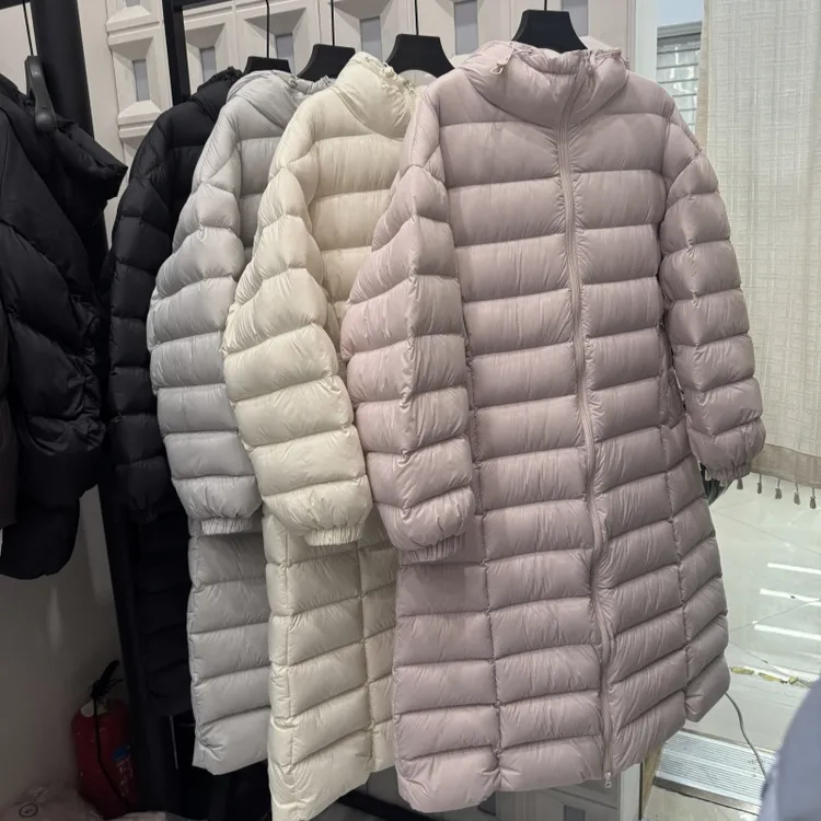 90白鹅绒排骨羽绒服女长款2025新款云朵泡芙宽松连帽过膝加厚外套