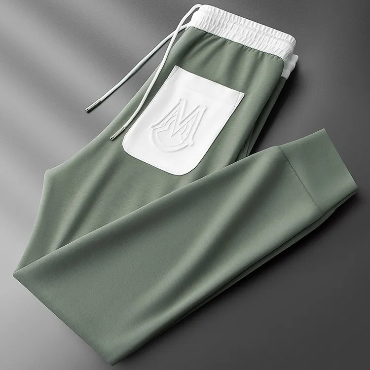 高端薄款柔软冰丝绿色运动裤子男夏季时尚小脚卫裤休闲裤男士修身