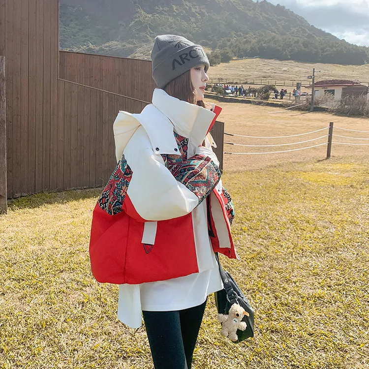 网红爆款羽绒服女冬季2025新款韩系设计感撞色拼接保暖小个子外套