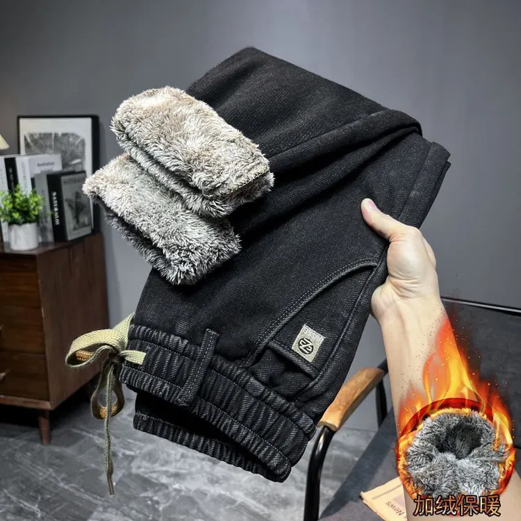 秋冬特厚加绒牛仔裤男松紧弹力新款宽松保暖百搭休闲哈伦直筒长裤