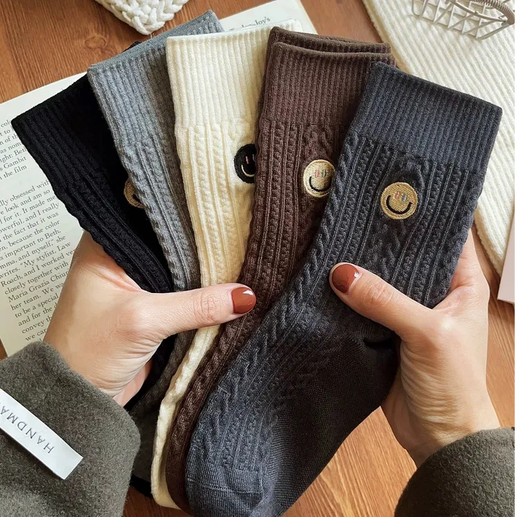 笑脸保暖袜子女秋冬款加厚仿羊绒韩版中筒袜ins潮无骨长袜堆堆袜