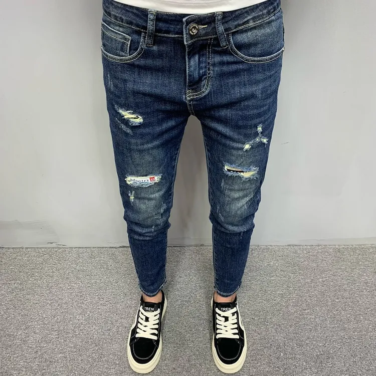 高档蓝色牛仔裤男款韩版潮流修身小脚百搭休闲痞帅个性破洞九分裤