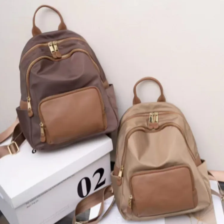 2024新款防水布配真皮日常小背包简约时尚休闲潮流百搭通勤双肩包