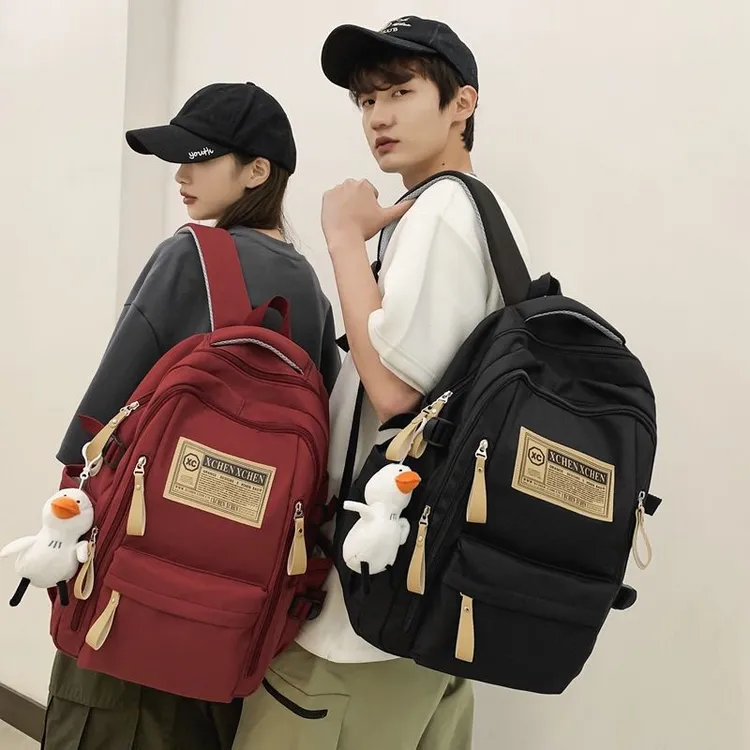 新款书包女大学生高中生中学生少女双肩包简约减负大容量男生背包