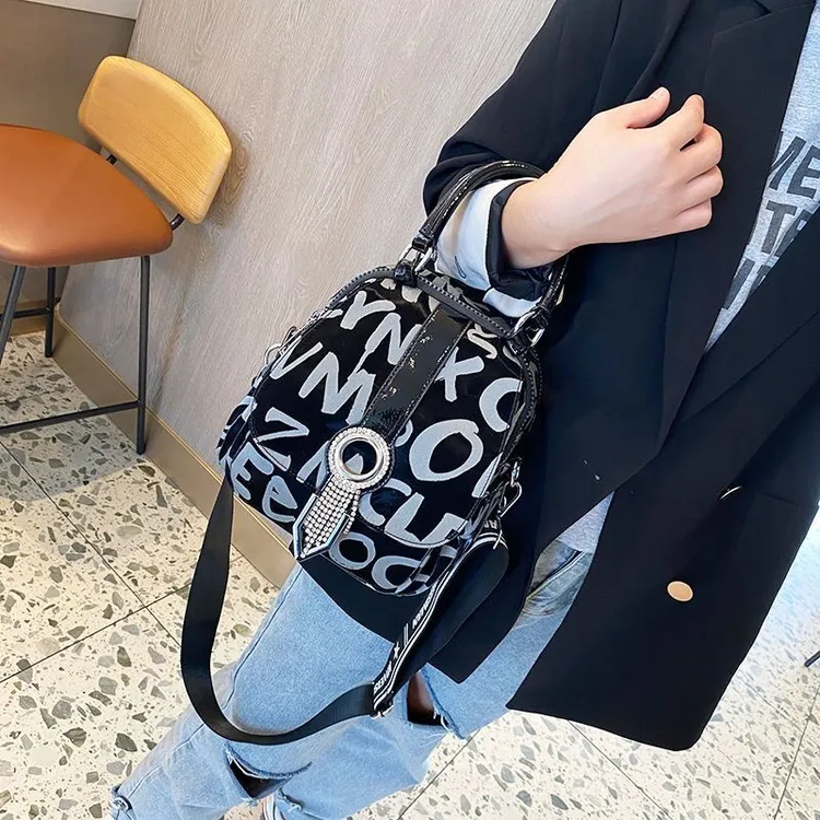 新款时尚字母尼龙布配真皮双肩包女包2025多功能百搭背包旅行包潮