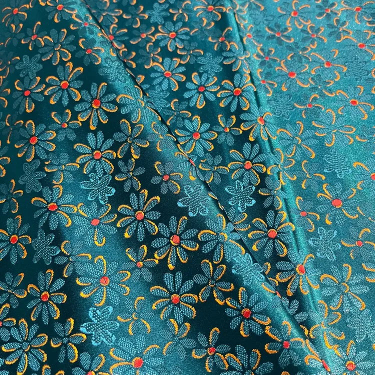 孔雀蓝小雏菊花 幅宽75公分 国风提花服装面料做手工面料