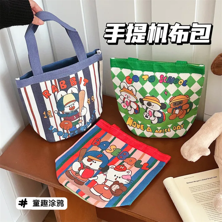 新款可爱涂鸦水桶包ins印花圆筒包日式复古帆布便当袋少女手提包