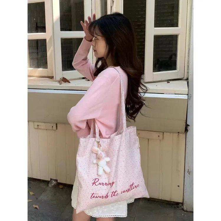 浪漫粉色碎花帆布包2024春夏新款单肩包女大学生上课大容量托特包