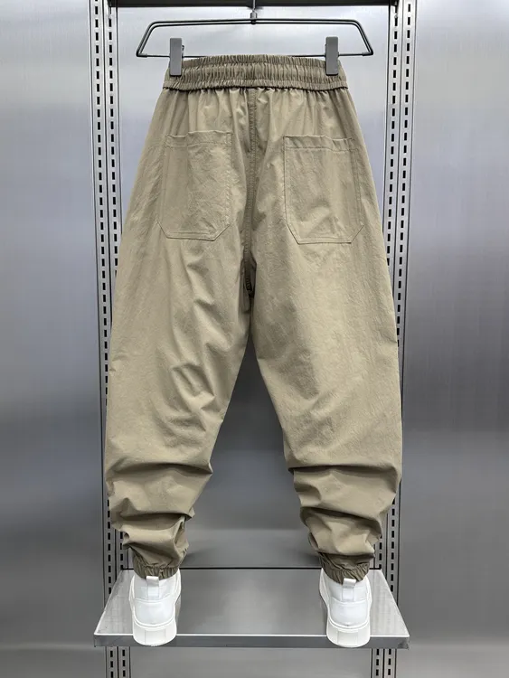 夏季薄款宽松哈伦休闲裤男士潮流百搭时尚束脚裤斜纹纽扣九分裤