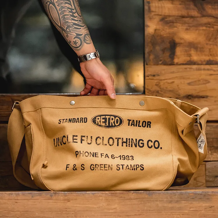马登工装美式复古大容量斜挎报童包休闲单肩字母帆布托特邮差包男
