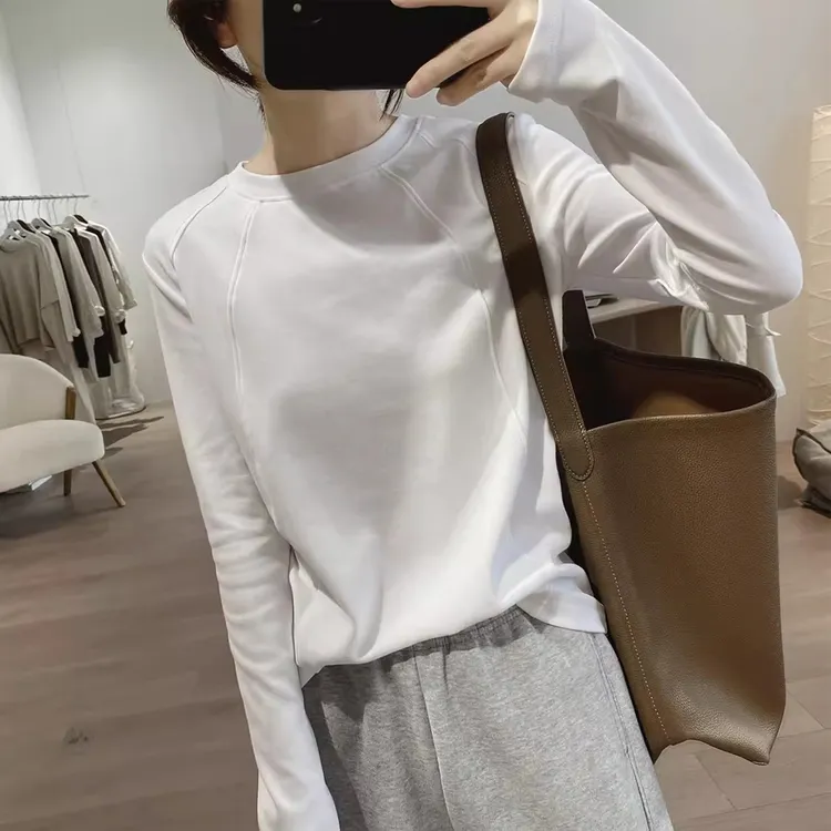 秋季新款棉质t恤女休闲显瘦圆领简约插肩袖减龄上衣拼接打底衫潮