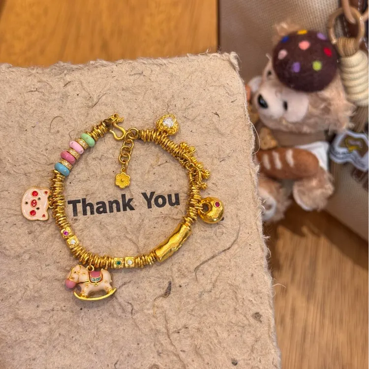 铜合金珐琅手链 新款黄金色摇摇木马古法盘缠多巴胺手链手工编织
