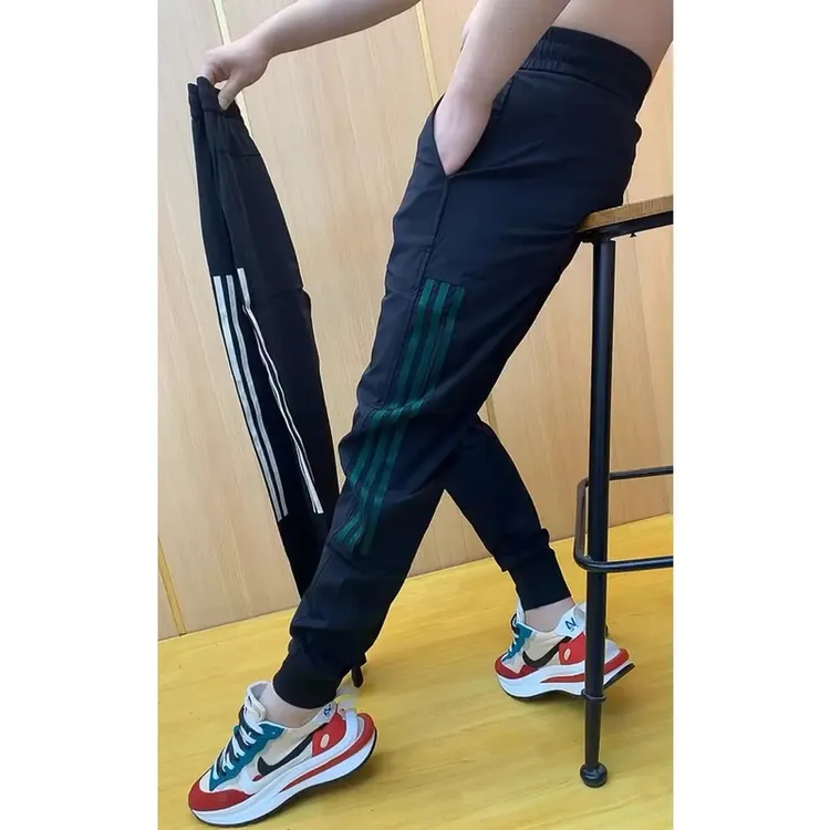 男士新款条纹拼接时尚休闲裤男小脚九分裤潮流百搭弹力哈伦裤裤子