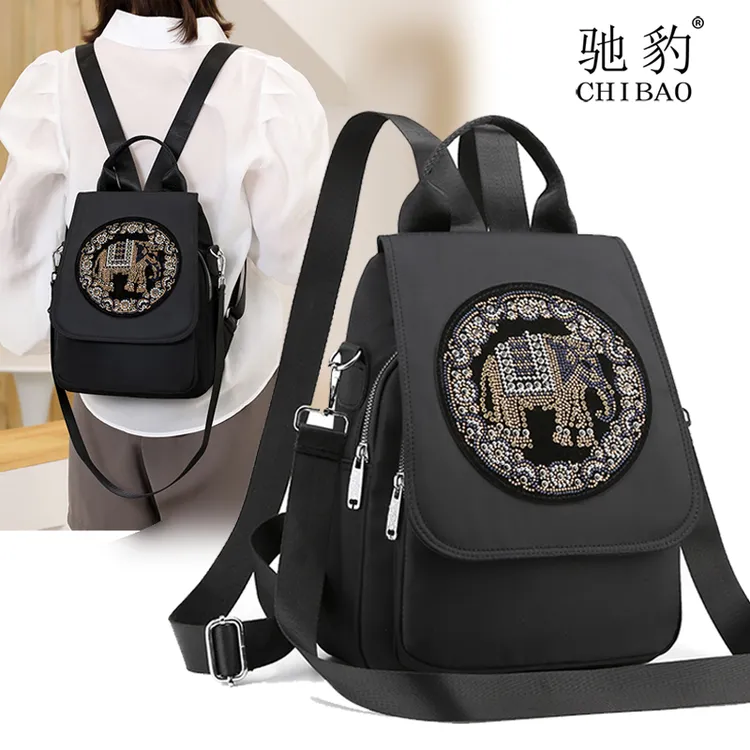 高级感双肩包女个性镶钻牛津布小背包时尚帆布百搭两用小众背包包