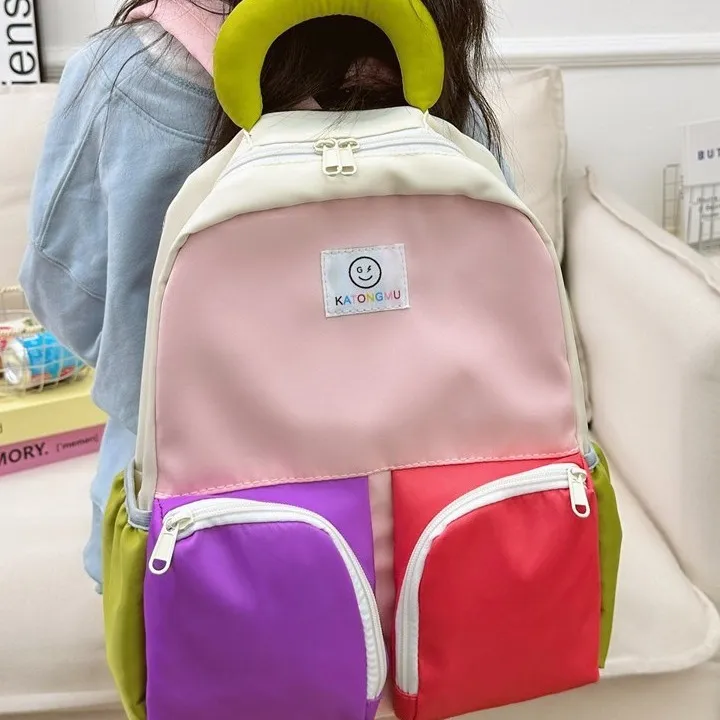 时尚新款韩国小众儿童双肩包可爱笑脸多巴胺系男女童幼儿园小书包