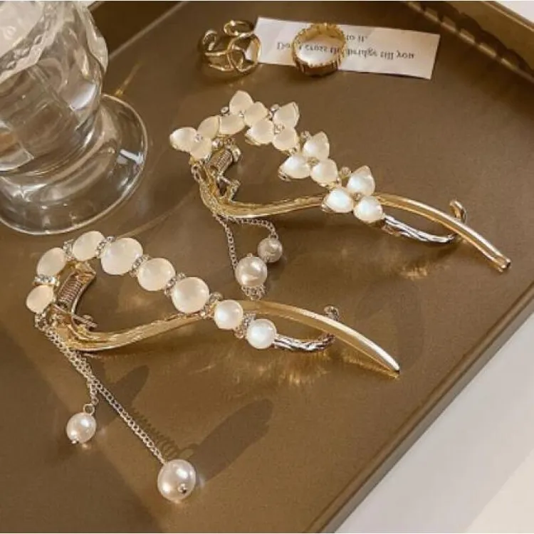 诗泊雅猫眼三叶草流苏网红扭扭夹一字夹