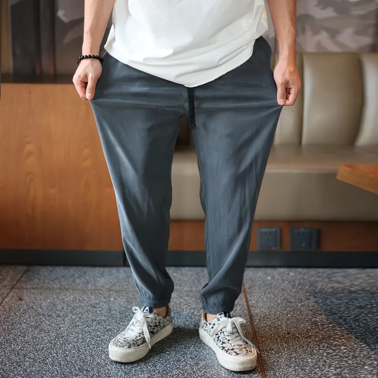 春夏薄款休闲裤九分铜氨丝男裤子束脚小脚纯色净版宽松中青年弹力
