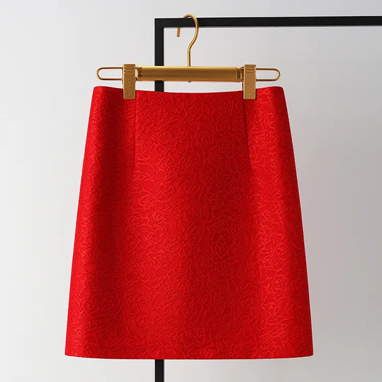 过年高端红色提花短裙半身裙女秋冬2026新款高腰a字裙包臀一步裙