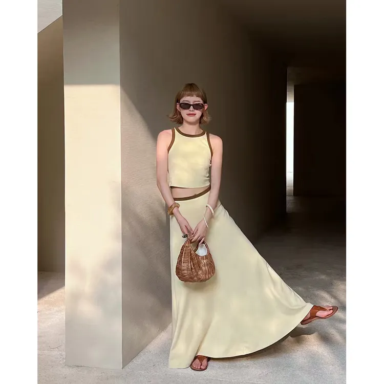 黄色设计感撞色镂空小背心女短款上衣+气质大裙摆半身裙套装女夏