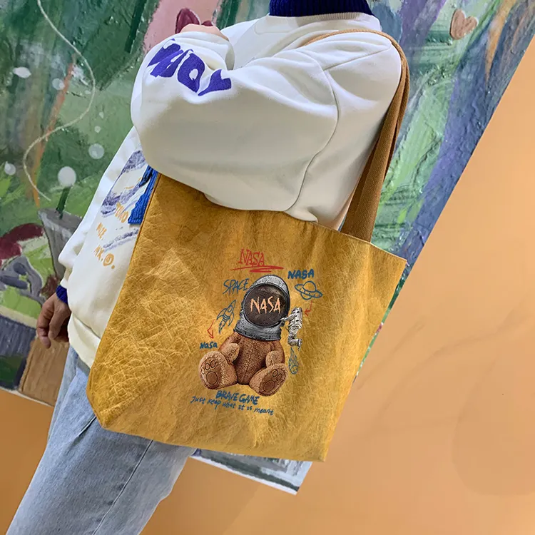 大容量防水耐磨通勤单肩包手提包原创复古帆布袋托特包杜邦纸包包