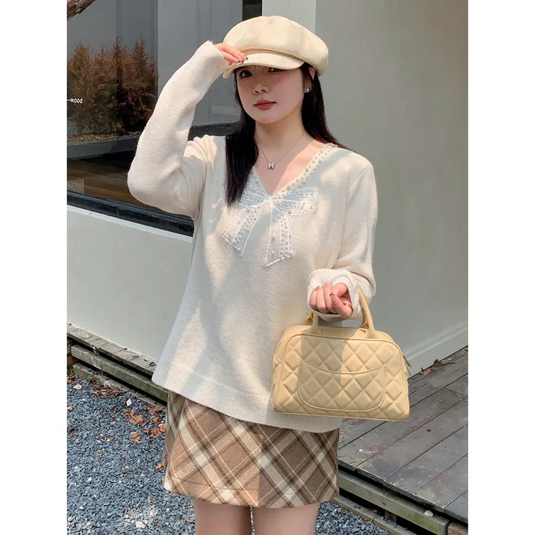 大码女装珍珠蝴蝶结上衣2024冬胖mm设计感毛衣女宽松针织衫