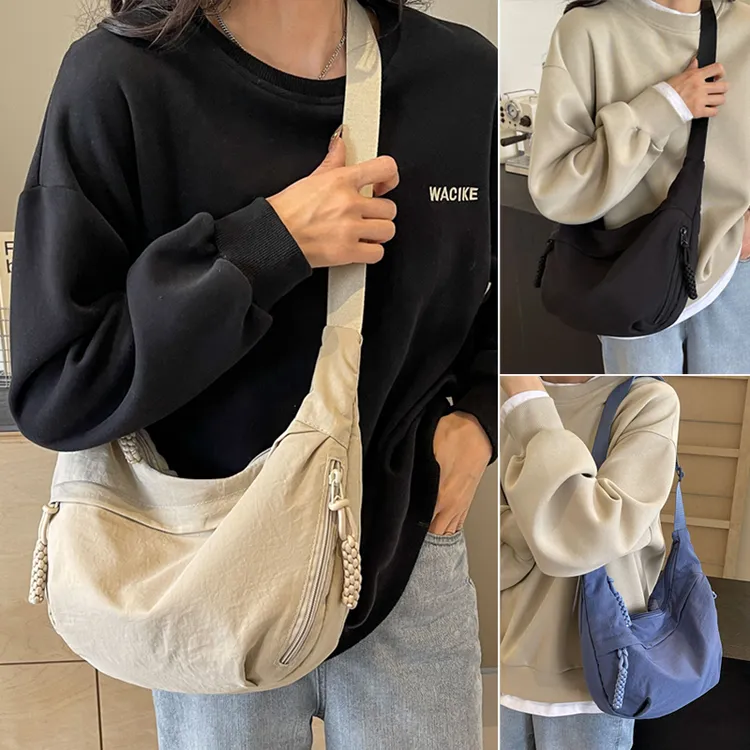 日系简约大容量斜挎包女2025新款学生小跨包单肩布包百搭饺子包女