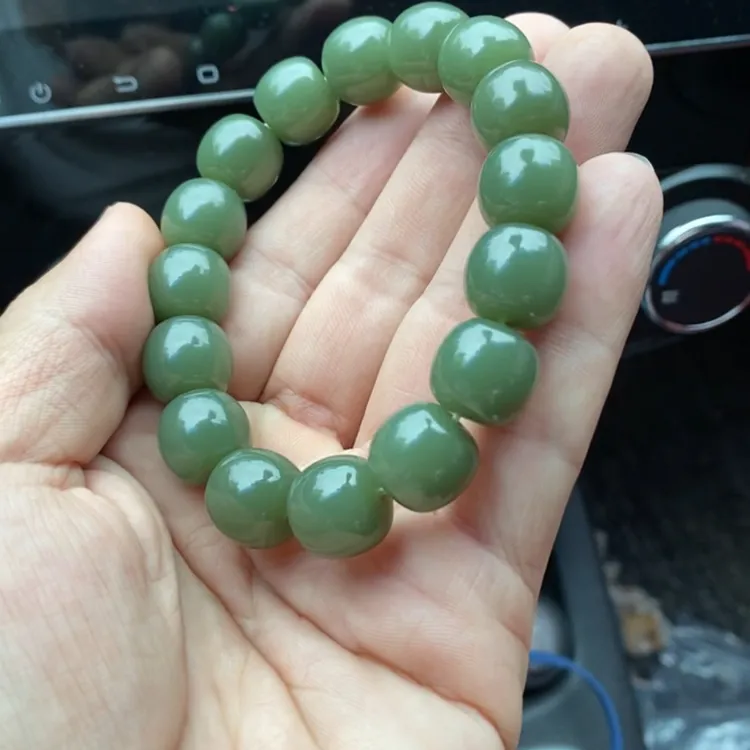 东北析木玉黑大块，老形珠13+14。玉质细腻结构均匀！