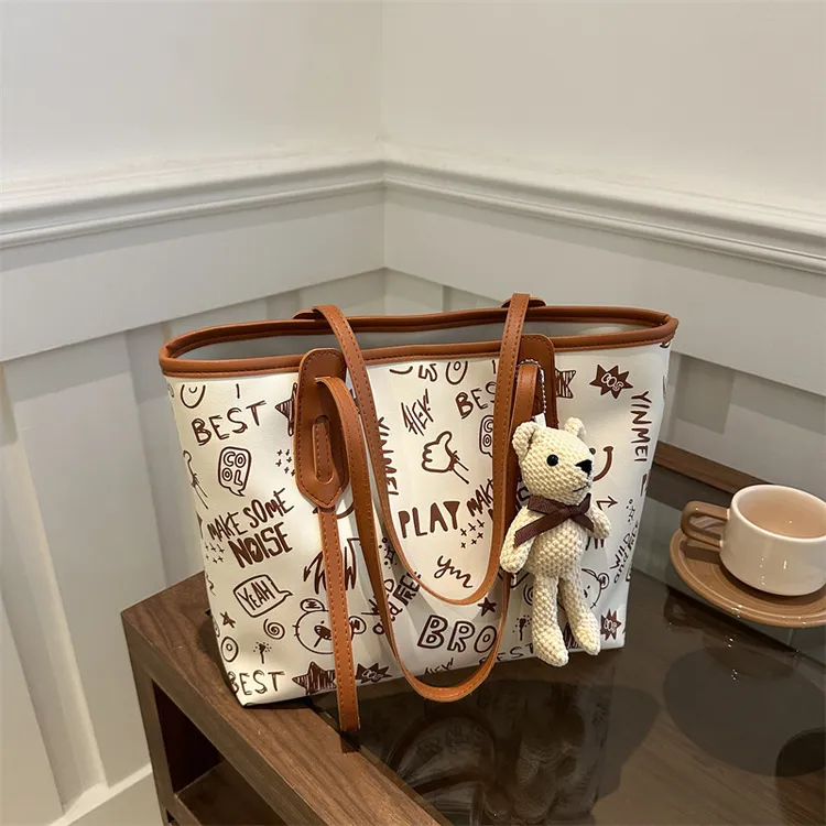 托特包女大容量单肩包高级感大包包2024新款潮小众涂鸦上课通勤包