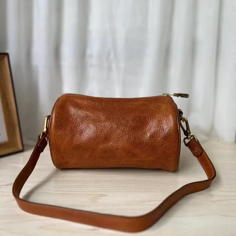 zizi头层植鞣牛皮潮流百搭复古小众单肩斜跨枕头包圆筒包手提包