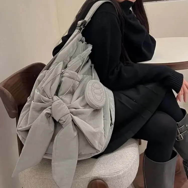 韩版抽绳随意单肩包双肩包两用蝴蝶结大容量多功能斜挎学生小众女