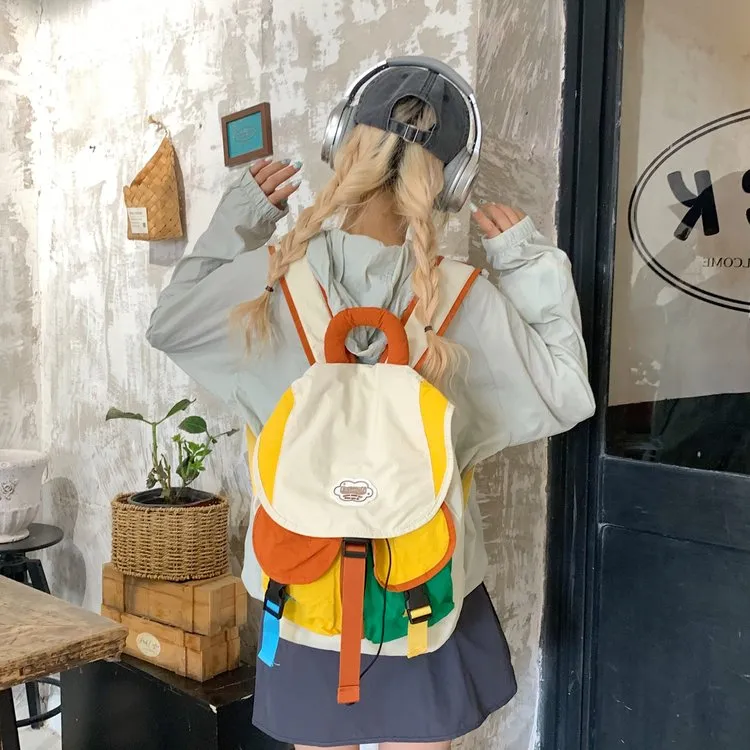 学生撞色书包女包包2025新款潮时尚可爱双肩背包休闲大容量帆布包