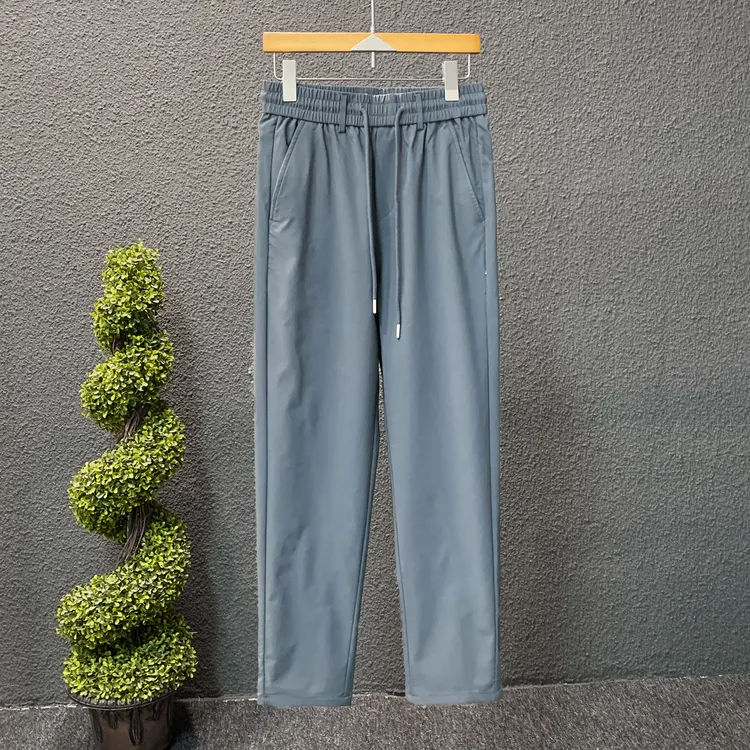 潮流简约纯色男青年裤子秋款时尚百搭修身中腰松紧绳无弹力直筒裤