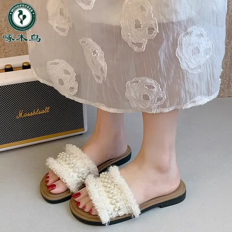 啄木鸟爆款沙滩拖鞋女夏外穿2025新款平软底配裙子一字拖休闲凉拖