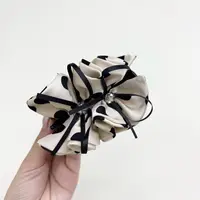 L128夕洛白色波点蝴蝶结丸子夹抓夹时尚百搭简约气质盘发夹发卡