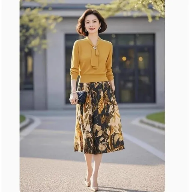 黄色针织套装2025年女装秋季新款高级感系带上衣印花半身裙两件套
