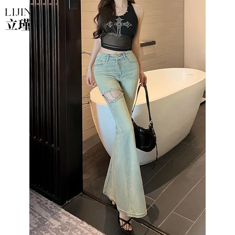 浅蓝色破洞微喇牛仔裤女2025秋季新款修身显瘦设计感百搭马蹄裤潮
