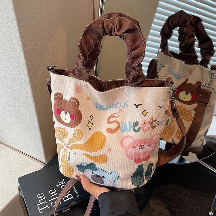 可爱插画水桶包包女手拎涂鸦帆布包ins日系卡通单肩包休闲斜挎包