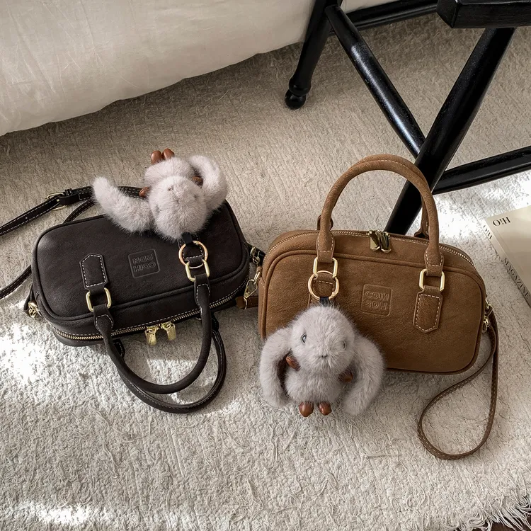 高级质感小包包女2025春夏新款手提枕头包波士顿设计感通勤斜挎包