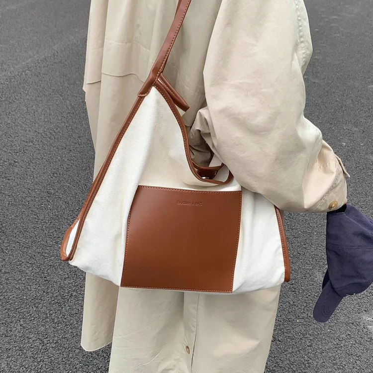 大容量新款托特包包2025女式上班通勤外出学生上课帆布包单肩包