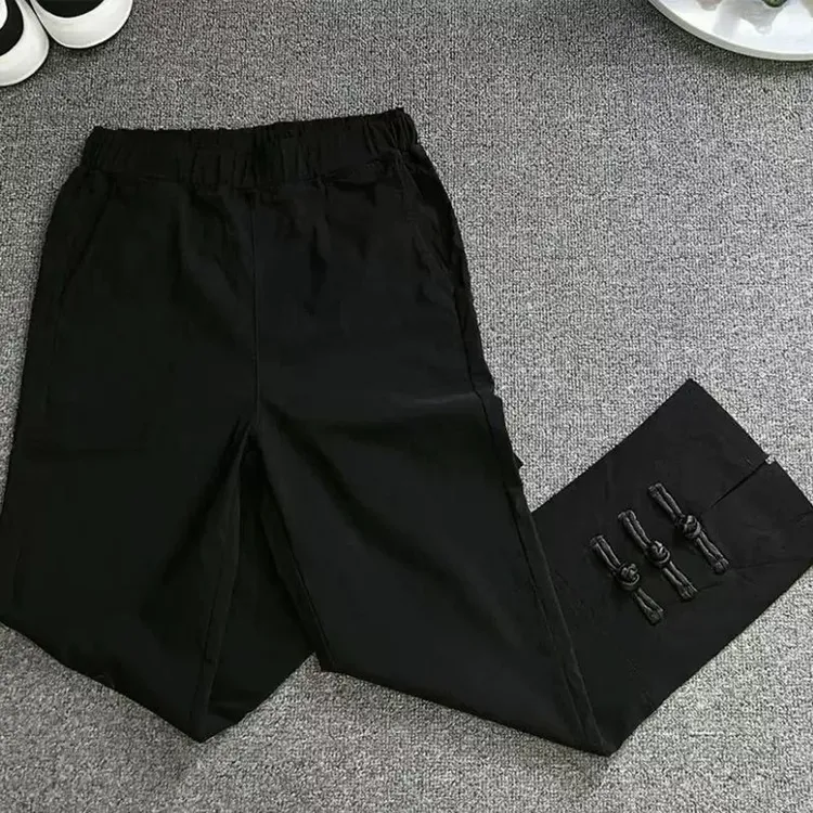 2025夏季薄料盘扣纸皮裤女松紧腰弹力显瘦微喇叭裤开叉七分裤潮