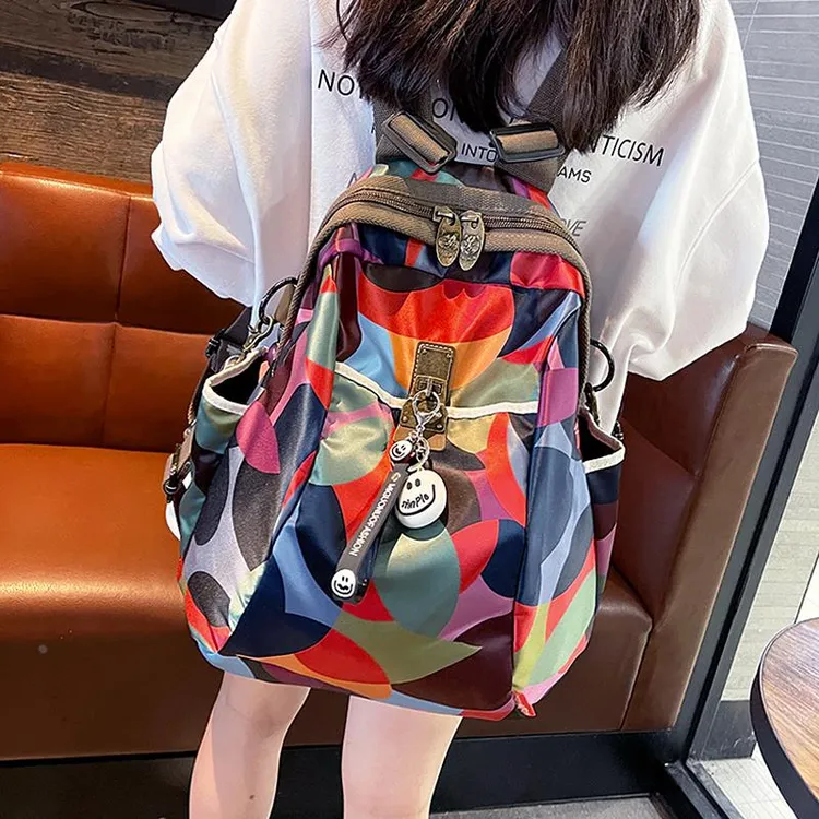 潮牌彩色印花双肩包女2025新款时尚牛津布女士印花大容量旅行背包