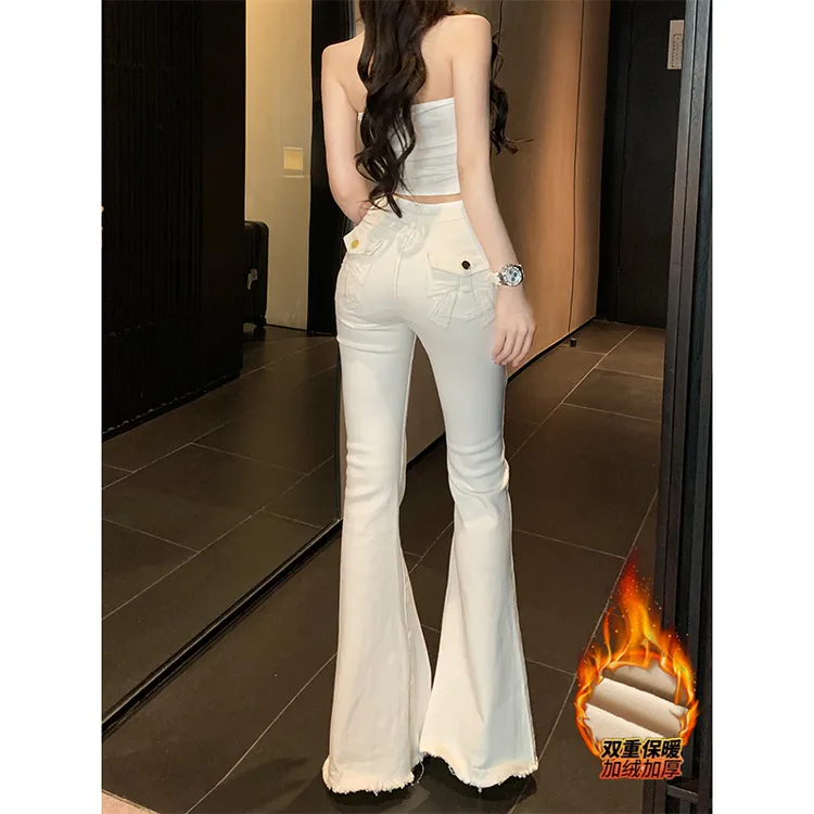 白色蝴蝶结少女加绒微喇叭牛仔裤2025年冬季新款高腰提臀毛边长裤