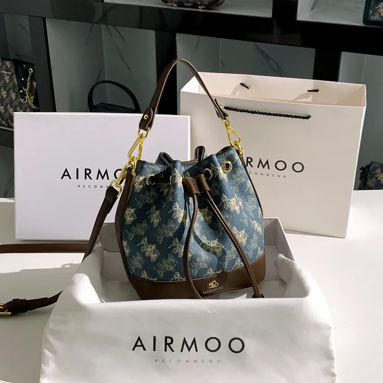 AIRMOO/艾姆轻奢包包女士小众时尚百搭单肩手提包质感通勤水桶包