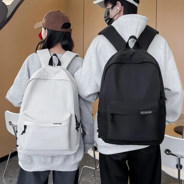 品庭韩版书包女休闲简约大容量双肩包初中高中大学生书包男背包