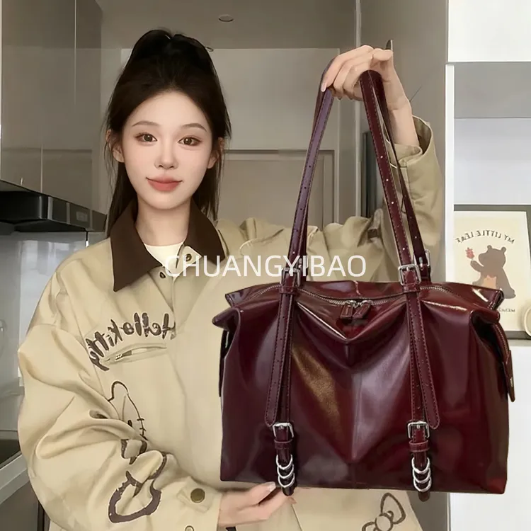 黑色荔枝纹手提包女2025新款上班超火小拎包高级感单肩斜挎水桶包