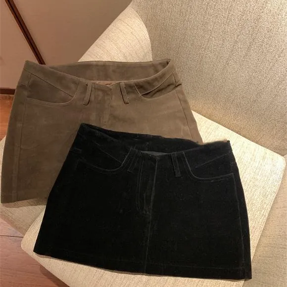 秋冬新款弧形高腰显瘦小众设计感a字黑色包臀半身裙高级修身短裙