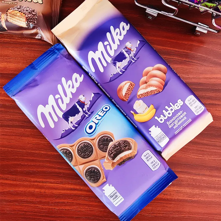 俄罗斯德国进口妙卡milka巧克力气泡奥利奥夹心巧克力榛仁草莓味