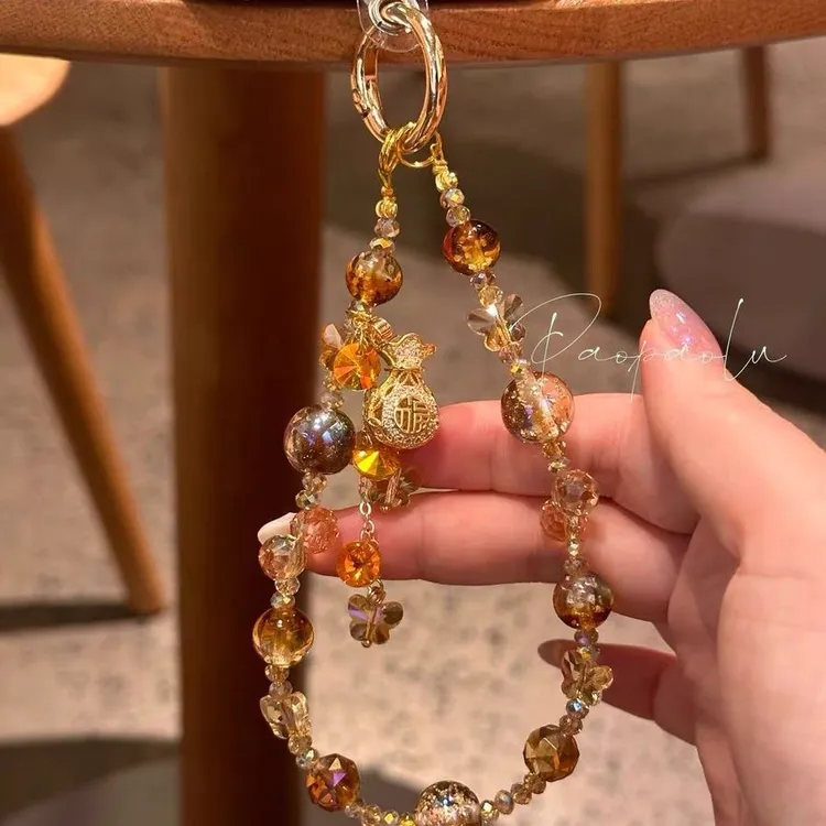 「吸金体质」金色福袋吊坠爆闪金箔夜光串珠手机链手机挂饰