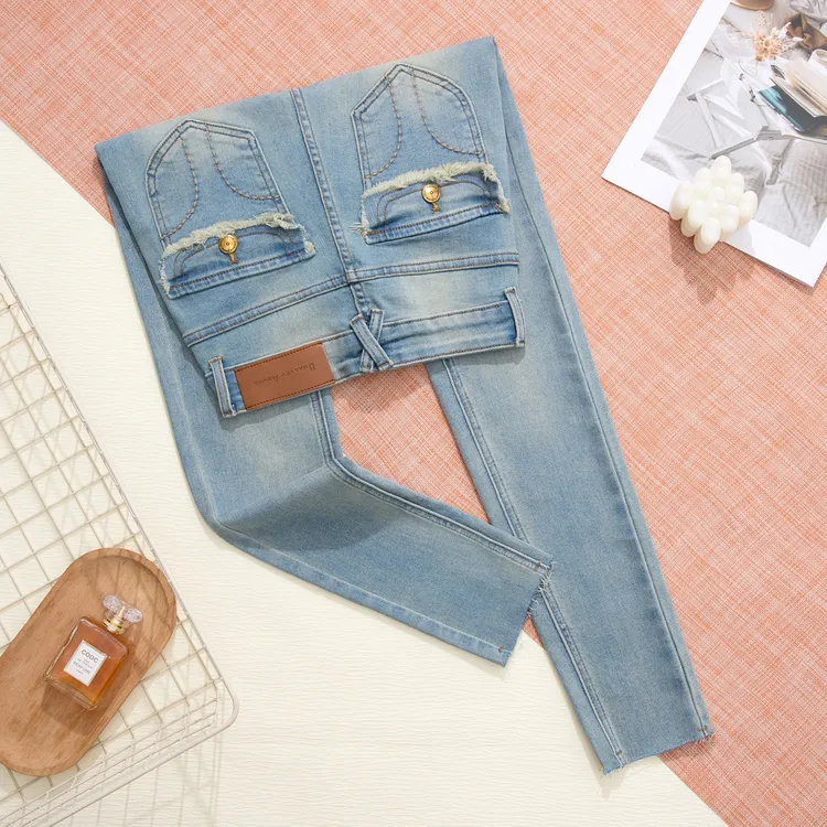 浅色网红辣妹紧身高腰显瘦铅笔牛仔裤秋冬新款时尚百搭小脚裤毛边