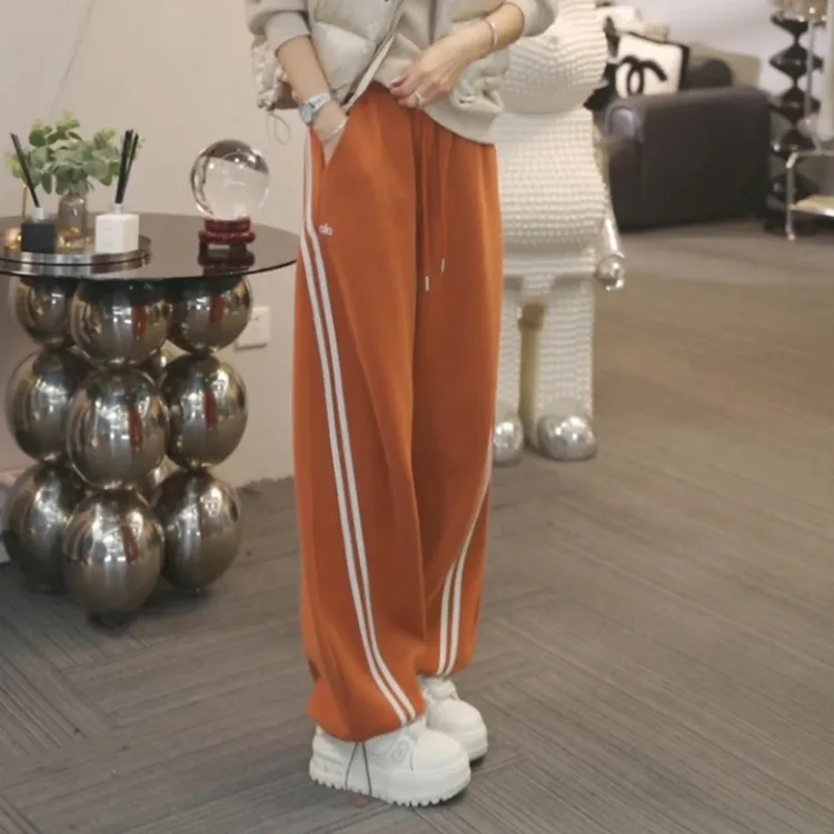 2025秋冬新款加绒加厚保暖休闲裤女弯刀裤宽松百搭高腰束脚卫裤子